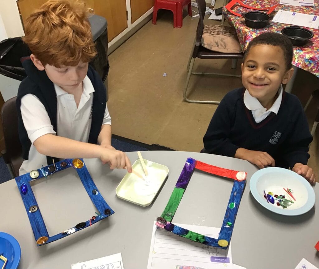 Young children doing arts and crafts.