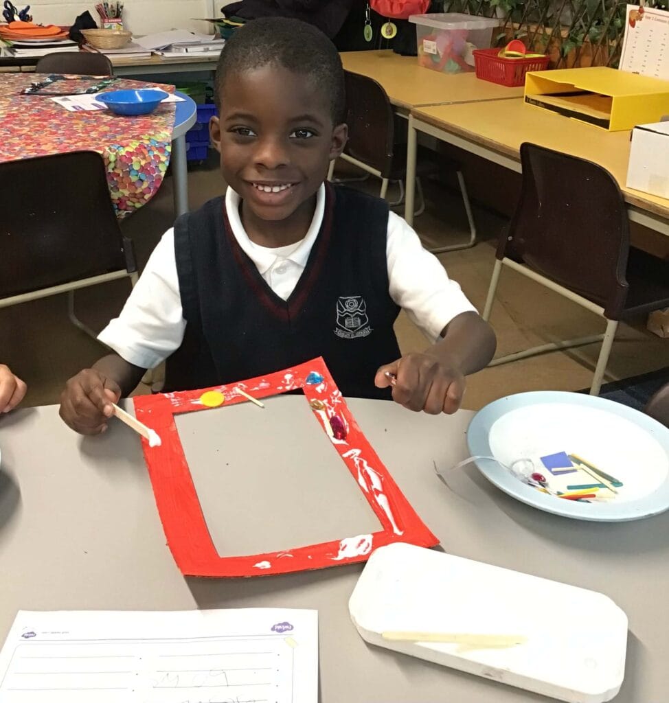 Young children doing arts and crafts.